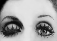 black and white photograph of a woman's eyes with long eyelashes