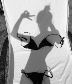 the shadow of a woman in a bathing suit