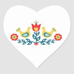 a heart shaped sticker with two birds and flowers