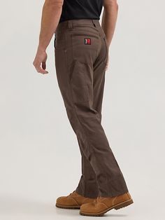 WORKWEAR WARDROBE STAPLE A style that works as hard as you do, our Wrangler® RIGGS WORKWEAR® Utility pants are designed to stand up to any job that comes their way. The durable yet lightweight pants feature reinforced front panels and a cotton blend construction with the right amount of stretch to keep you moving comfortably. Function-first pockets, including a large utility side pocket and reinforced, Cordura-lined back pockets, provide plenty of storage options for small tools and other on-the Rugged Workwear Men, Fitted Brown Work Pants With Pockets, Brown Work Pants With Side Pockets, Brown Work Pants With Hip Pockets, Brown Straight Leg Work Pants, Brown Utility Work Pants With Belt Loops, Brown Full Length Work Pants With Belt Loops, Workwear Wardrobe, Wrangler Pants