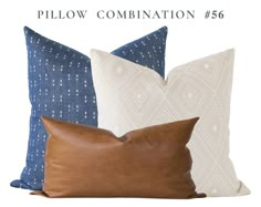 three pillows with different colors and patterns on them, one in blue and the other in white