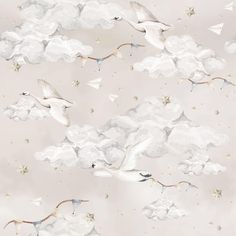 a flock of birds flying through the sky with stars and clouds in the back ground