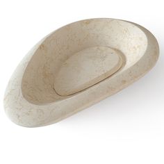 a white bowl sitting on top of a table next to a knife holder and spoon