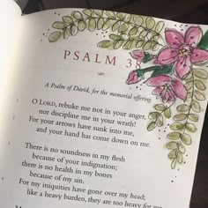 an open bible with flowers on it and the words,'psalm 3'written in red