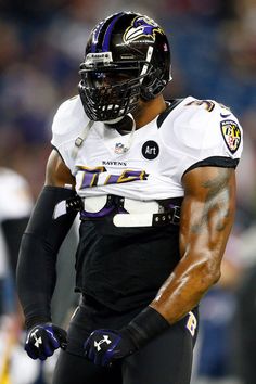 a football player in uniform standing on the field