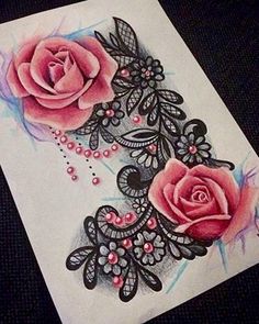 a drawing of two pink roses on white paper with black and blue trimmings