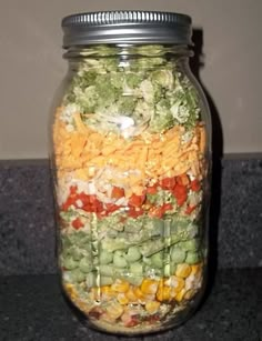 a jar filled with lots of different types of food