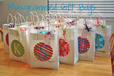 several bags with different designs on them sitting on a table