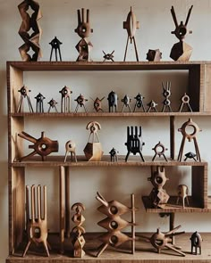 a shelf filled with lots of different types of wooden objects on top of each other