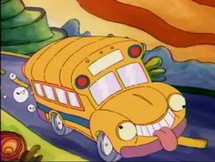 the school bus is driving down the road with its mouth open and tongue sticking out