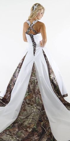 a woman in a camo and white wedding dress with her back to the camera