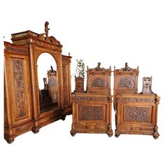 four pieces of carved wood furniture on display