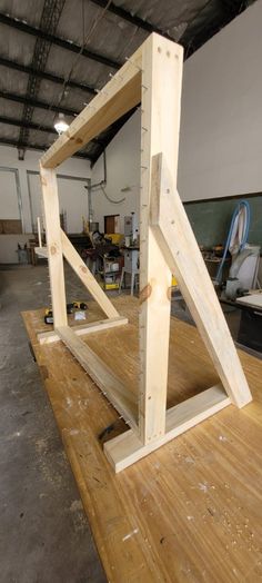 an unfinished piece of wood sitting on top of a wooden table