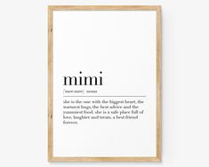 a framed print with the words mimi in black and white, on top of a wooden frame