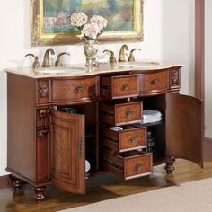 a bathroom vanity with two sinks and drawers