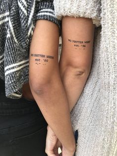 two people holding hands with tattoos on their arms and the words, no matter what they are