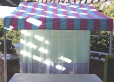 a table under a tent in the shade