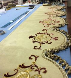 the table is covered with an elaborately designed runner