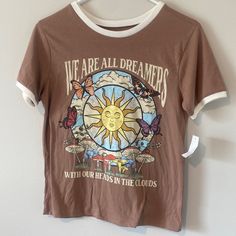 Size S. Super Soft And Cute Hippy Light Brown Ringer T-Shirt! New With Tags Size Small. Features Lots Of Flora And Fauna Including The Sky, Clouds, The Sun, Fungi And Mushrooms, Butterflies, Flowers, And Grass. Features A Logo “We Are All Dreamers With Our Heads In The Clouds.” So Hippie Whimsigothic Witchy Y2k Astrology Vibes. Eclectic Townhouse, Heads In The Clouds, Butterflies Flowers, Hippie Shirt, Black Crow, Steven Tyler, Lenny Kravitz, Sun Shirt, Janis Joplin