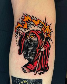 a tattoo with a wizard holding a wand