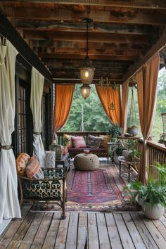 an outdoor covered porch with furniture and curtains