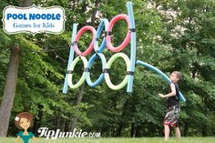 a young boy is playing with an inflatable pool noodle game for kids