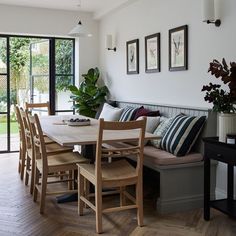 an image of a dining room setting with table and chairs