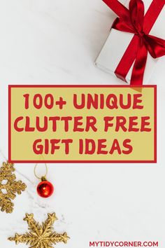 a white table topped with christmas decorations and a red ribbon that says, 100 unique clutter free gift ideas