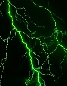 green and white lightning strikes in the night sky