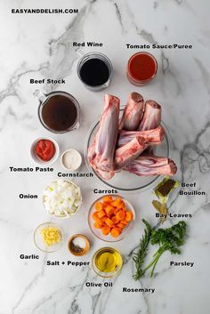 the ingredients needed to make chicken wings on a marble countertop