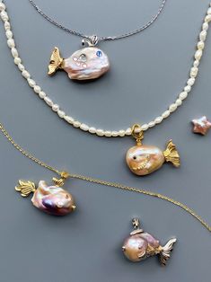 Check out our pearl fish pendants - each pendant is unique. The pendant features a lustrous baroque pearl that forms the body of a whimsical fish. The fins and tails are crafted from gold-tone metal, adding a touch of luxury to this charming piece. These pearl fish pendants are perfect for adding an elegant yet playful touch and enchantment to any piece of jewelry. Whether you're dressing up for a special occasion or adding a touch of glamour to your everyday look, these pendants are the perfect Funky Pearl Jewelry, Beaded Necklace With Charm, Handmade Metal Jewelry, Pearl Necklace Stack, One Piece Jewelry, Pearl Jewlery, Unique Pearl Jewelry, Beaded Fish, Baroque Pearls Jewelry