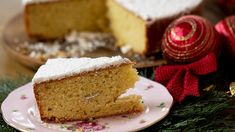 a piece of cake sitting on top of a white plate next to a christmas ornament