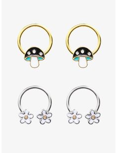 three pairs of nose rings with flowers on each end and two different colors in the middle