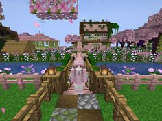 a woman walking across a bridge in a minecraft village with flowers on the ground