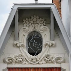 an ornate window on the side of a building