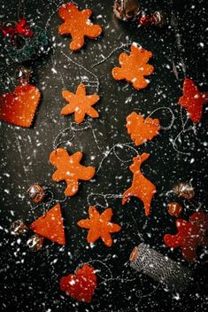 gingerbread cutouts are arranged in the shape of christmas trees and snowflakes