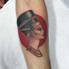 an egyptian woman's tattoo on the arm