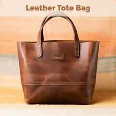 Whether you’re in the office or on the go, this leather tote is the perfect everyday bag. Its spacious main compartment can hold a 15" laptop and has two matching top handles for an easy use. Crafted from full grain calf leather, this Tote bag has the room and structure for all your day to day to day essentials. #totebag #shoppingbag #shoulderbag Everyday Leather Lined Laptop Bag With Top Handle, Everyday Top Handle Laptop Bag With Leather Lining, Everyday Laptop Bag With Leather Lining And Tote Shape, Everyday Use Laptop Bag With Top Handle, Everyday Laptop Bag With Leather Lining, Everyday Leather-lined Laptop Tote Bag, Everyday Laptop Bag With Top Handle, Soft Leather Tote Laptop Bag For Travel, Everyday Smooth Grain Tote Briefcase