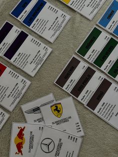 several identification cards are laid out on the floor next to each other with different colors