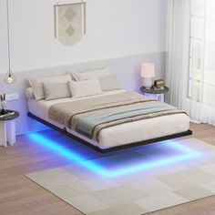 a bed with blue lights underneath it in a room