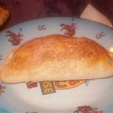 a piece of bread sitting on top of a blue plate