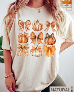 Retro Fall Pumpkin Bow Shirt, Fall Coquette Bow Sweatshirt, Autumn Pumpkin Tee, Fall T-Shirt , Autumn Sublimation Design, Autumn Bow Shirts -UNISEX T-SHIRTS - Women typically wear one size down for a fitted look. -The Models in the pictures are wearing 2 sizes up, Please order 2 sizes up for an oversized look DETAILS AND FABRIC: * Comfort Colors 1717 * 100% ring-spun cotton How you order: Select your size and the color that you want from the drop down bar, add to cart, and check out.  How to ord Cute Short Sleeve Tops For Fall, Cute Short Sleeve Fall Shirt, Cute Short Sleeve Shirt For Fall, Cute Orange Crew Neck Top, Cute White Tops For Fall, White Short Sleeve Top For Fall, Cute White Fall Shirt, Cute White Shirt For Fall, White Short Sleeve Shirt For Fall