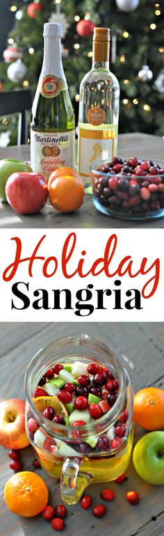 holiday sangria with apples, cranberries and oranges in front of a christmas tree