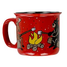 a red campfire mug with a black bear on it