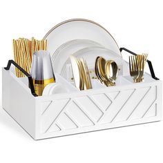 a white and gold dinnerware holder with forks, knives, and spoons in it