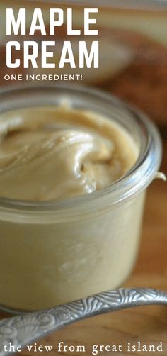 an image of a jar of maple cream on a table with a spoon in it