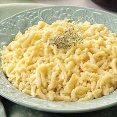 a plate full of macaroni and cheese on a table