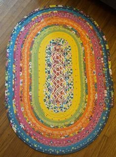 a multicolored rug is on the floor