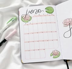 an open planner with water lilies on it