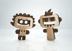 two wooden toys made to look like cartoon characters